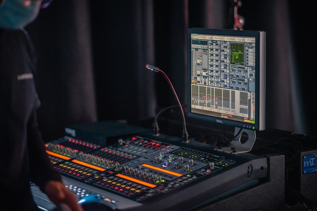 Live television control room with multiple video monitors and switcher panel